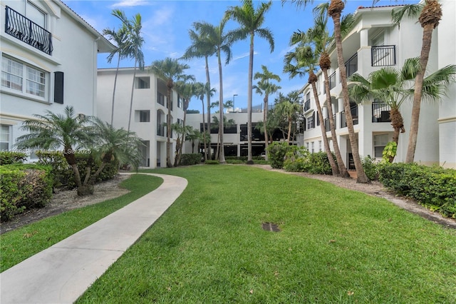 view of home's community featuring a lawn