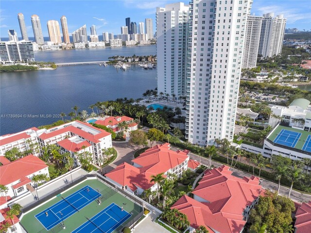 birds eye view of property featuring a view of city and a water view