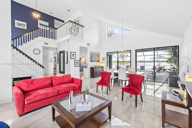 living room featuring stairway, high vaulted ceiling, and a healthy amount of sunlight