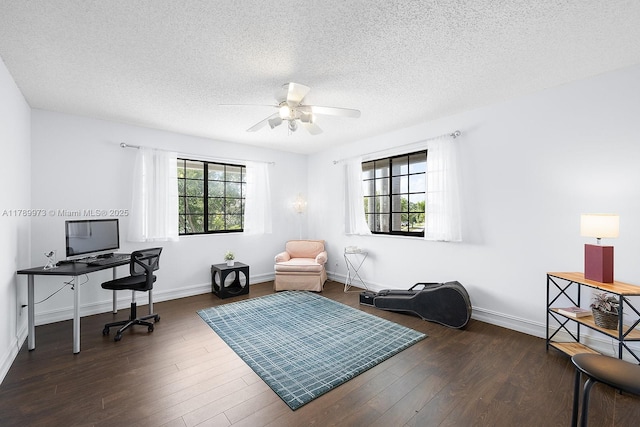 office featuring baseboards, a ceiling fan, a textured ceiling, and wood finished floors