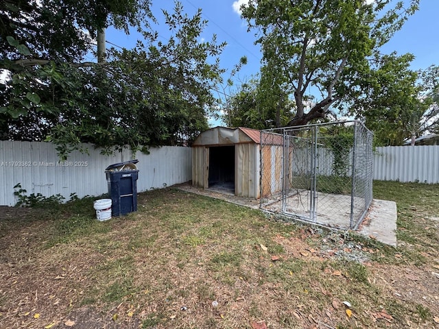 view of shed with a fenced backyard