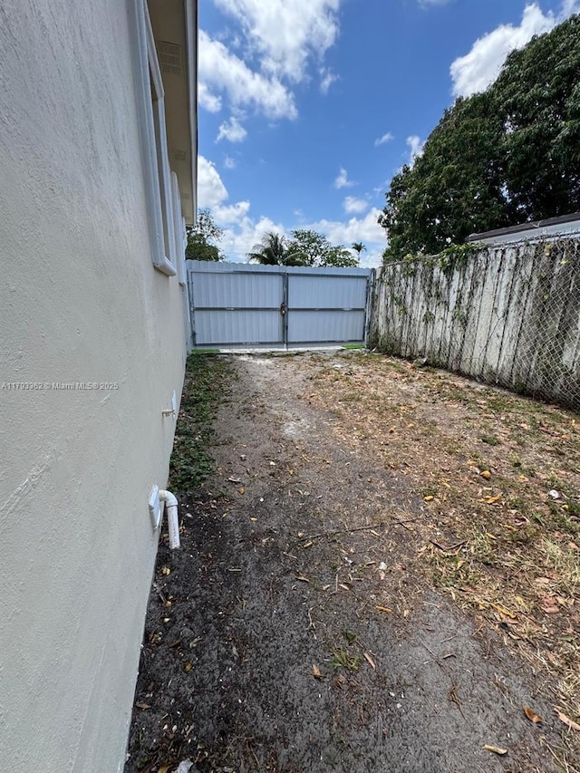 view of yard with a gate and fence