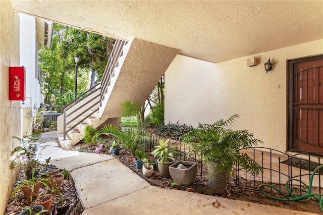 property entrance featuring stucco siding