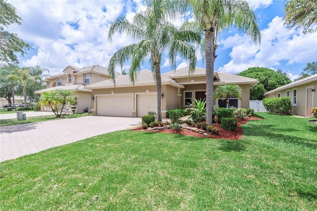 6017 NW 56th Cir, Coral Springs, FL 33067 - mediterranean / spanish-style home with stucco siding, driveway, a garage, and a tiled roof