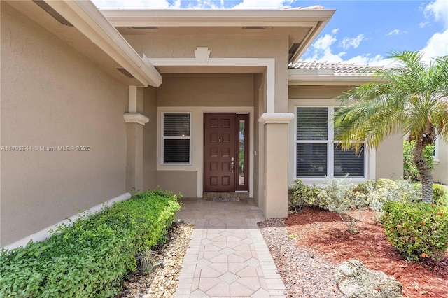 6017 NW 56th Cir, Coral Springs, FL 33067 - doorway to property featuring stucco siding