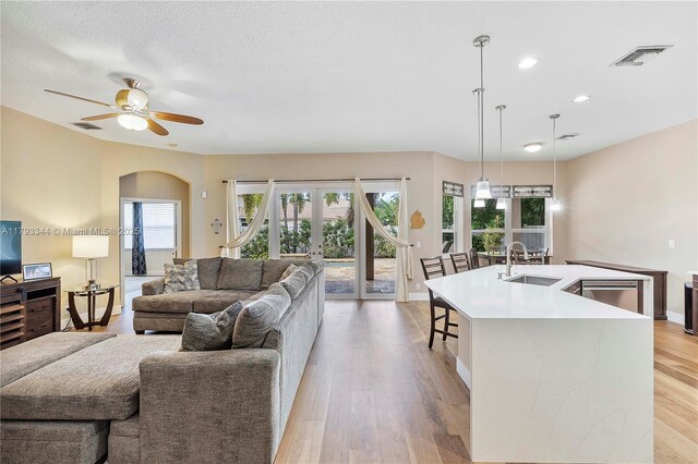 6017 NW 56th Cir, Coral Springs, FL 33067 - living area with healthy amount of natural light, a ceiling fan, light wood-style flooring, recessed lighting, and baseboards