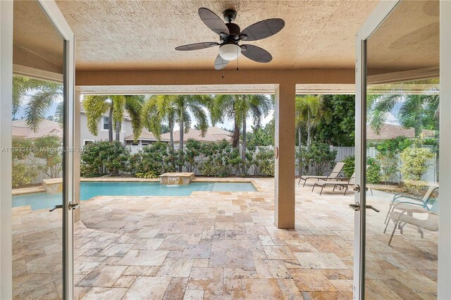 6017 NW 56th Cir, Coral Springs, FL 33067 - view of swimming pool with a patio, ceiling fan, and a fenced backyard