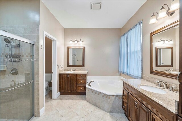 6017 NW 56th Cir, Coral Springs, FL 33067 - bathroom with a stall shower, a bath, toilet, tile patterned floors, and two vanities