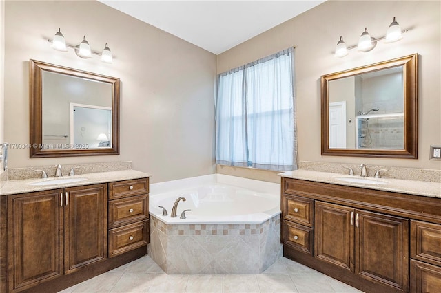 6017 NW 56th Cir, Coral Springs, FL 33067 - bathroom featuring two vanities, a bath, tile patterned flooring, and tiled shower