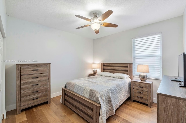 6017 NW 56th Cir, Coral Springs, FL 33067 - bedroom featuring light wood finished floors and a ceiling fan