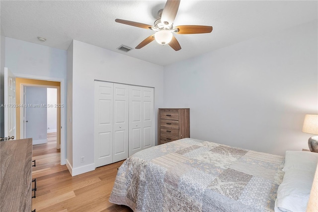 6017 NW 56th Cir, Coral Springs, FL 33067 - bedroom featuring light wood-type flooring, a closet, and ceiling fan