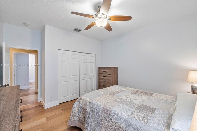 6017 NW 56th Cir, Coral Springs, FL 33067 - bedroom featuring light wood-type flooring, a closet, and ceiling fan