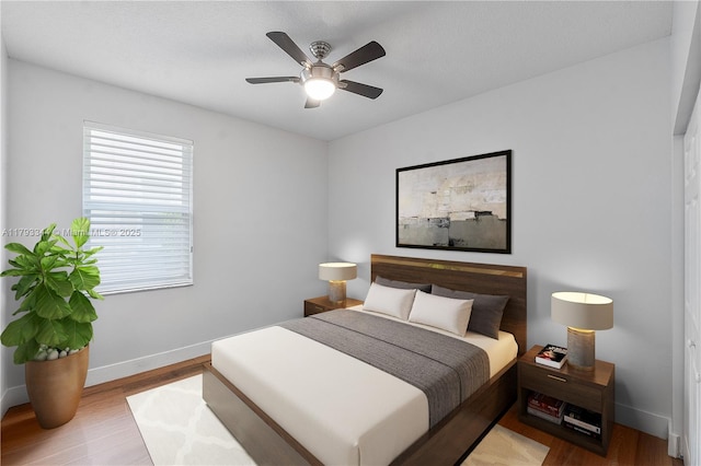 6017 NW 56th Cir, Coral Springs, FL 33067 - bedroom with wood finished floors and a ceiling fan