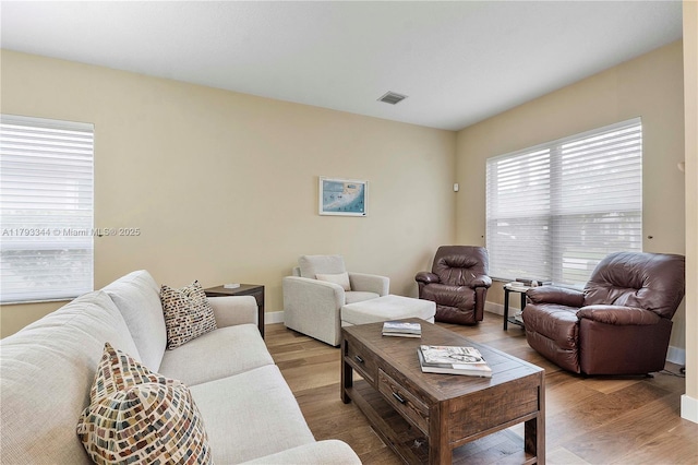 6017 NW 56th Cir, Coral Springs, FL 33067 - living area featuring wood finished floors and baseboards