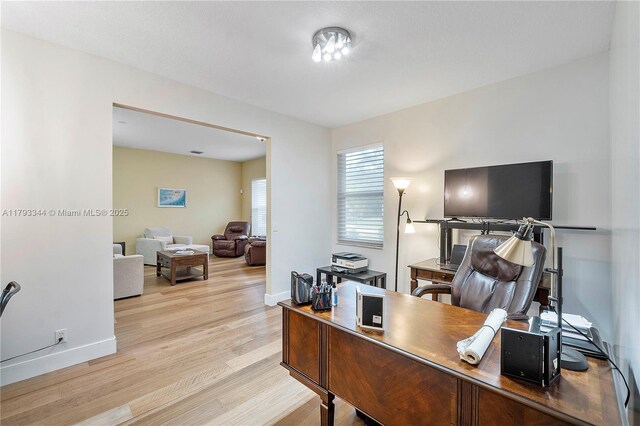 6017 NW 56th Cir, Coral Springs, FL 33067 - home office featuring light wood finished floors and baseboards