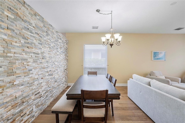 6017 NW 56th Cir, Coral Springs, FL 33067 - dining room featuring wood finished floors and a chandelier