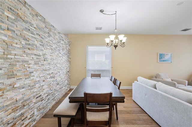 6017 NW 56th Cir, Coral Springs, FL 33067 - dining room featuring wood finished floors and a chandelier