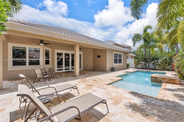 6017 NW 56th Cir, Coral Springs, FL 33067 - view of pool featuring a ceiling fan, a fenced backyard, a patio, and a jacuzzi