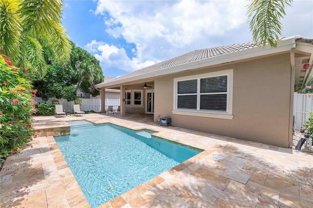 6017 NW 56th Cir, Coral Springs, FL 33067 - view of swimming pool with ceiling fan, a fenced backyard, a patio area, and a hot tub