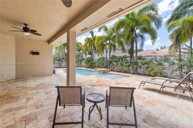 6017 NW 56th Cir, Coral Springs, FL 33067 - fenced backyard with a ceiling fan and a patio