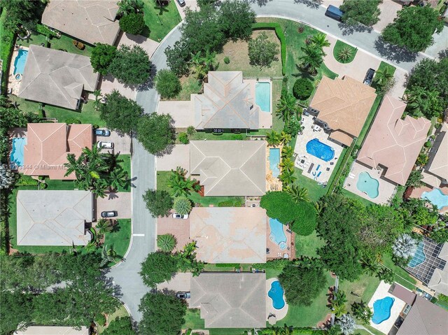 6017 NW 56th Cir, Coral Springs, FL 33067 - aerial overview of property's location featuring a pool area and nearby suburban area