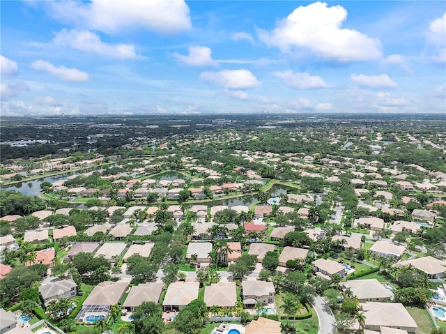 6017 NW 56th Cir, Coral Springs, FL 33067 - aerial view of property and surrounding area featuring nearby suburban area and a large body of water
