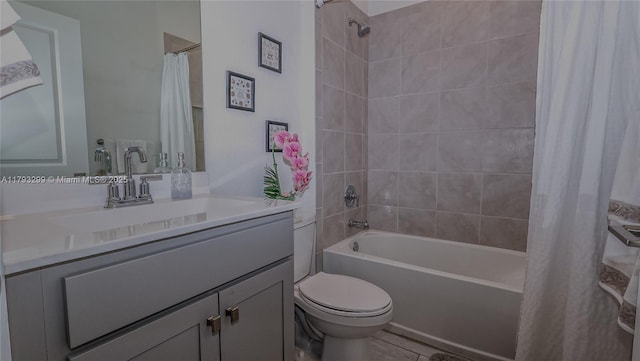 bathroom featuring toilet, shower / bath combo, and vanity