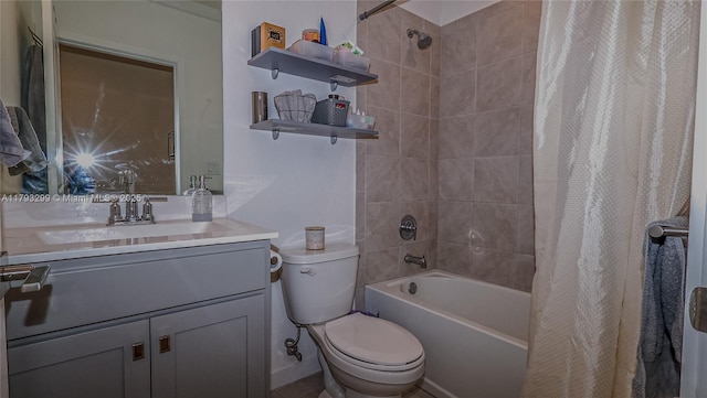 full bathroom featuring toilet, shower / tub combo with curtain, and vanity
