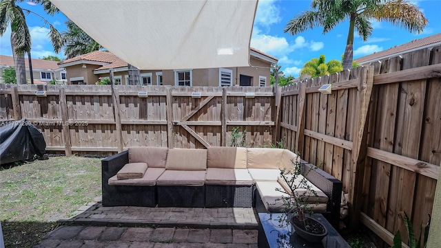 view of patio with an outdoor hangout area and a fenced backyard