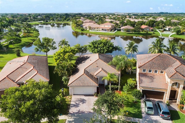 drone / aerial view with a water view and a residential view
