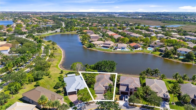 bird's eye view with a water view and a residential view