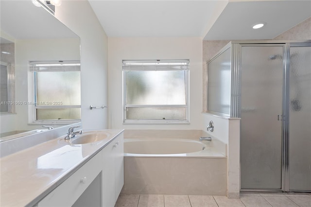 full bathroom with vanity, a stall shower, a bath, and tile patterned floors