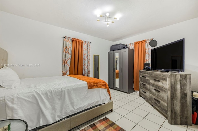 bedroom featuring light tile patterned flooring