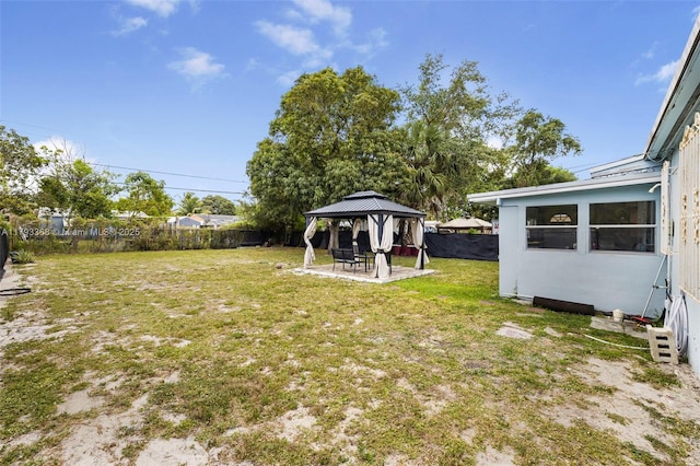 view of yard featuring a gazebo, a fenced backyard, and a patio