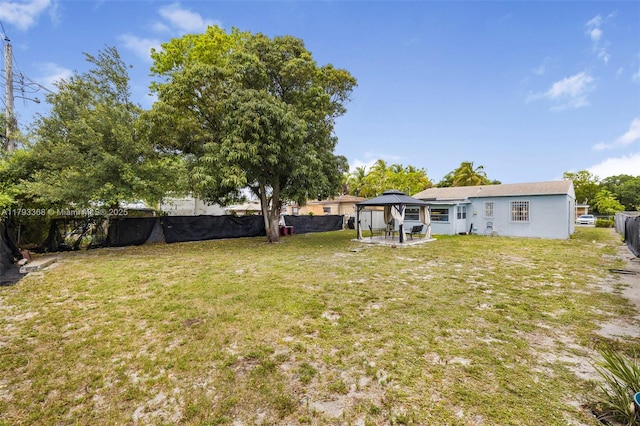 view of yard featuring a patio, a gazebo, and a fenced backyard