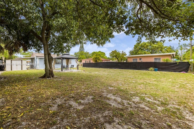 view of yard featuring a gazebo and fence