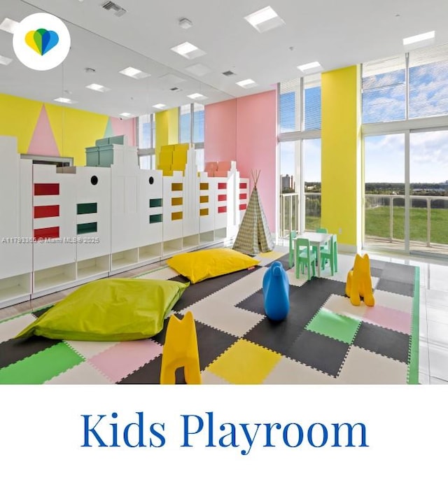 2000 Metropica Way Unit 1710, Sunrise, FL 33323 - playroom featuring visible vents, plenty of natural light, and expansive windows