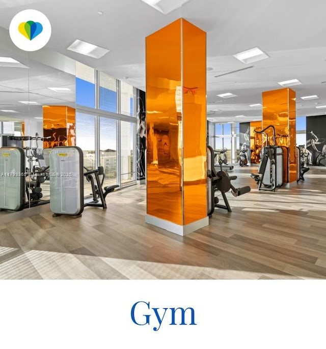 2000 Metropica Way Unit 1710, Sunrise, FL 33323 - gym with floor to ceiling windows and wood finished floors