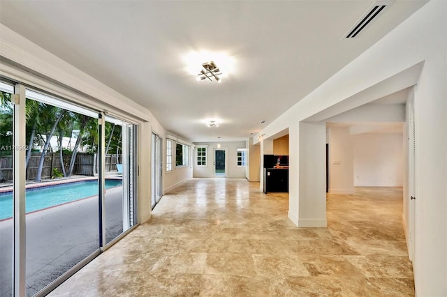 255 Ridgewood Rd, Key Biscayne, FL 33149 - unfurnished living room with baseboards