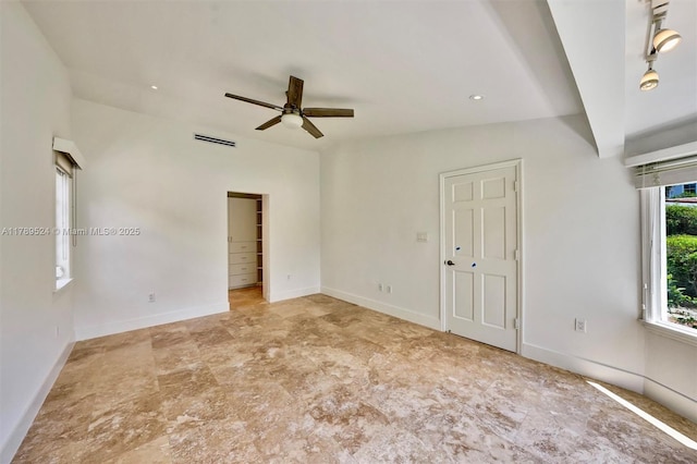 255 Ridgewood Rd, Key Biscayne, FL 33149 - empty room with a ceiling fan and baseboards