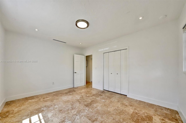 255 Ridgewood Rd, Key Biscayne, FL 33149 - unfurnished bedroom with baseboards and a closet
