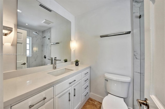 255 Ridgewood Rd, Key Biscayne, FL 33149 - bathroom with a marble finish shower, toilet, vanity, and baseboards
