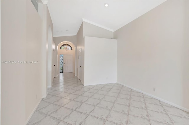 7141 Haviland Cir, Boynton Beach, FL 33437 - empty room with crown molding, arched walkways, baseboards, and a chandelier