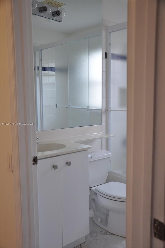 half bathroom with toilet and vanity