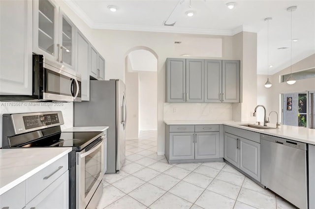 7141 Haviland Cir, Boynton Beach, FL 33437 - kitchen featuring a sink, light countertops, stainless steel appliances, gray cabinetry, and glass insert cabinets