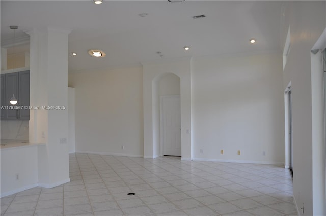 spare room with light tile patterned flooring, baseboards, recessed lighting, and ornamental molding