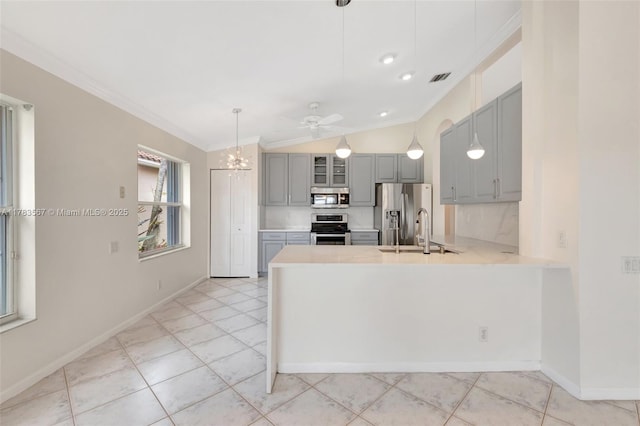 7141 Haviland Cir, Boynton Beach, FL 33437 - kitchen with appliances with stainless steel finishes, a sink, light countertops, gray cabinetry, and ornamental molding