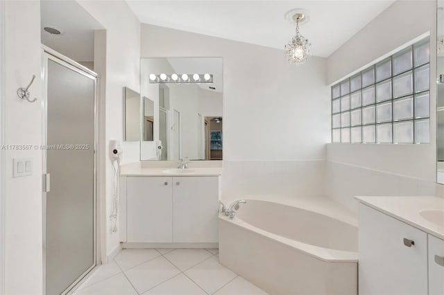 7141 Haviland Cir, Boynton Beach, FL 33437 - full bath with two vanities, a sink, a garden tub, and a stall shower