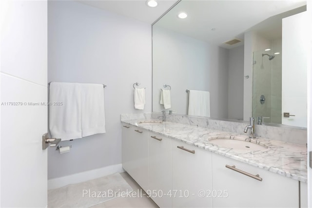950 Brickell Bay Dr Unit 4710, Miami, FL 33131 - full bathroom with double vanity, tile patterned floors, recessed lighting, a shower, and baseboards