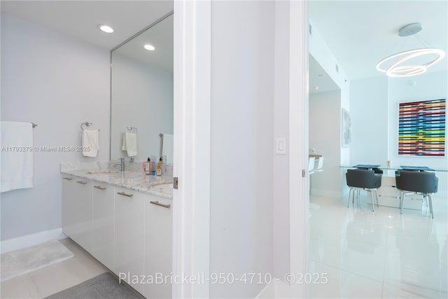 950 Brickell Bay Dr Unit 4710, Miami, FL 33131 - full bathroom with tile patterned flooring, vanity, recessed lighting, and baseboards